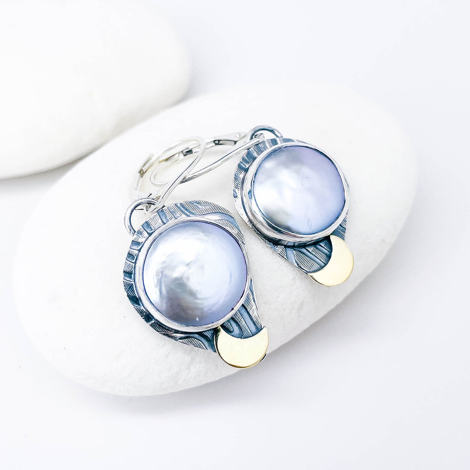 Pair of silver earrings with freshwater pearls and gold accents