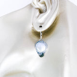 Silver earrings with freshwater pearls on manequin