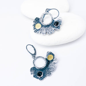 Pair of silver earrings with black spinel and gold accents